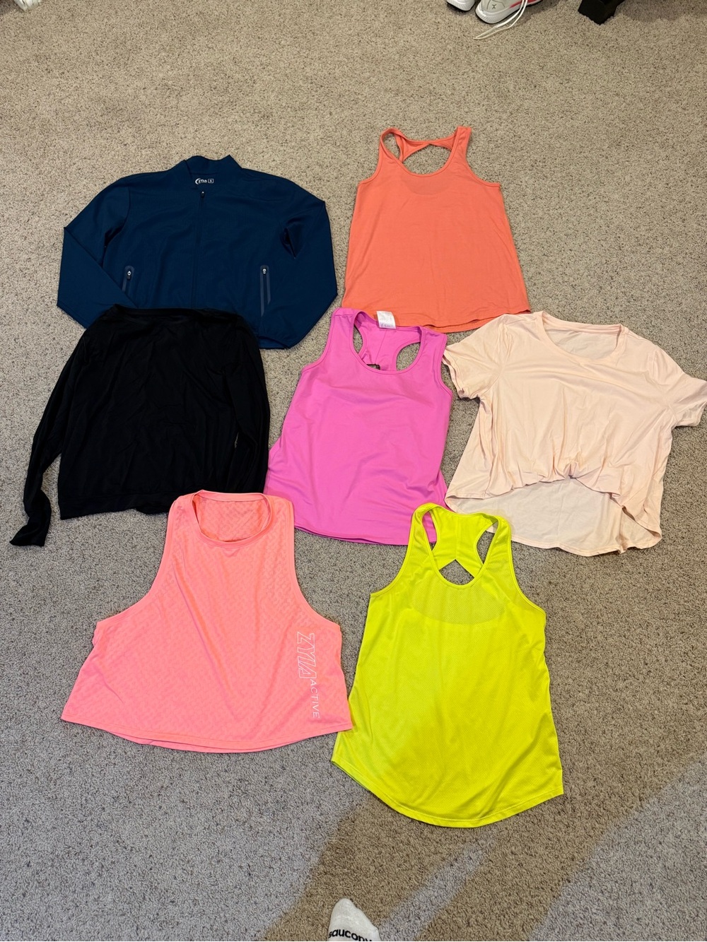 Women’s Zyia tops. Size medium. Or fit like medium. Most are new without tags.